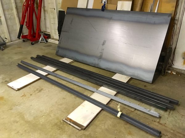 Now we're talking! This is a little over 500lbs of 2" square tubing and 2" angle iron, all 3/16" thickness. The coup de grace is the 4x8 sheet of 3/16" steel plate. That piece weighs about 300 pounds by itself.