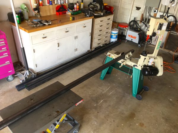 Note the use of a Harbor Freight hydraulic lift cart as a support. These pieces are too heavy to rely on the saw to hold them, and the lift cart allows precise height adjustment to keep the stock level while cutting.