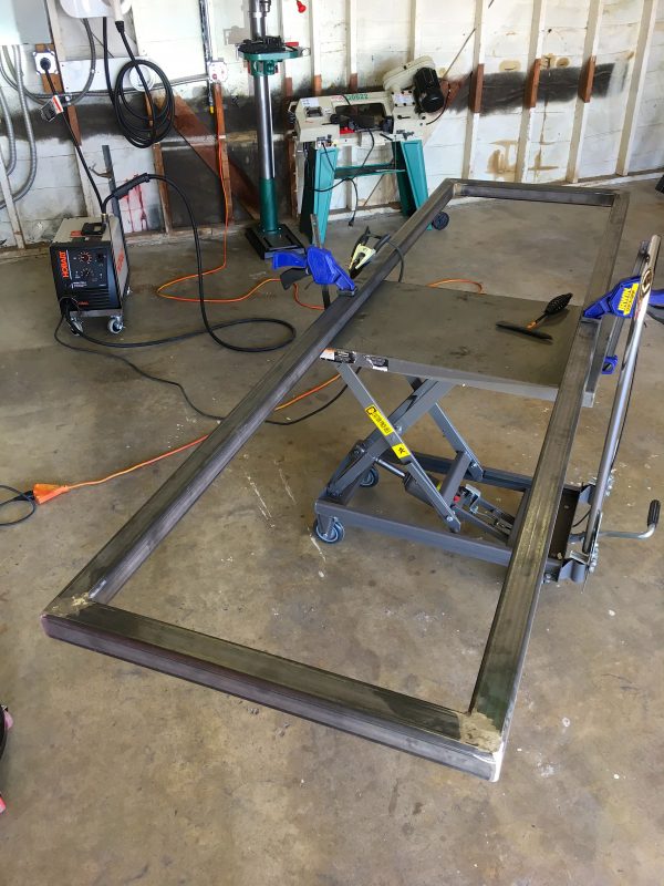 Here's the basic box section all welded up. I took the time to grind the welds smooth, because the legs need to have a flat square surface to sit on. Most welds are left au naturel, for everyone to make fun of.